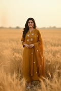 Model wearing mustard yellow chikankari embroidered kurta set with dupatta