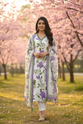 Model wearing white and purple floral print A-line cotton suit with plain white straight pants and dupatta